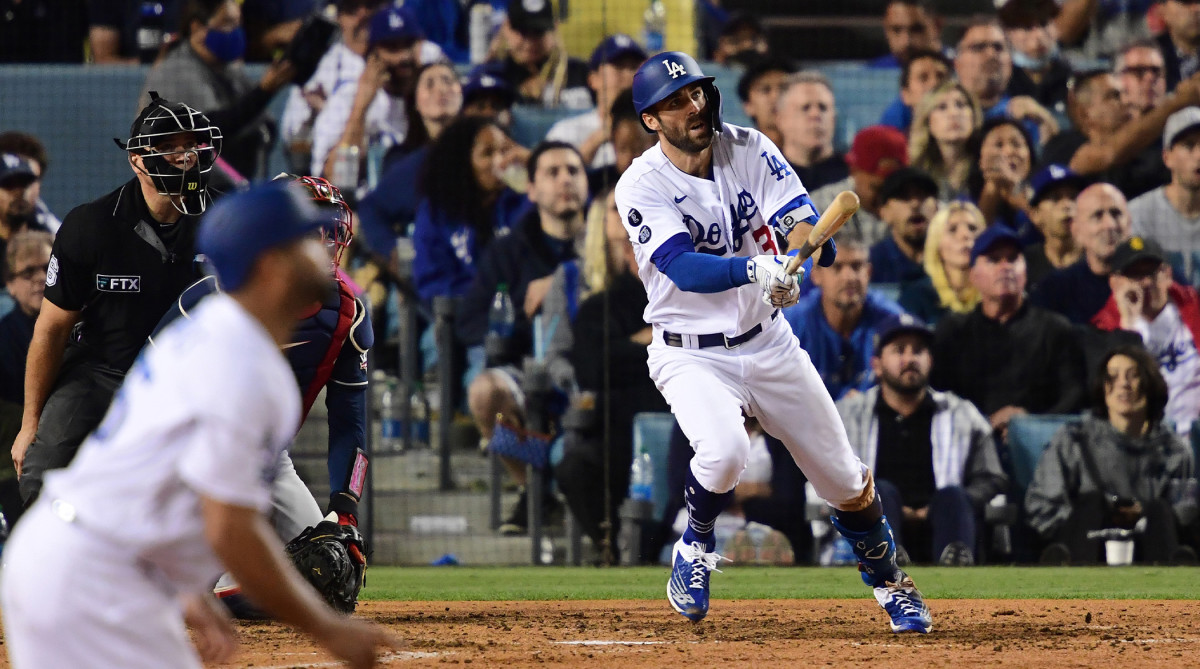Oct 21, 2021; Los Angeles, California, USA; Los Angeles Dodgers left fielder Chris Taylor (3) hits a two run home run in the fifth inning against the Atlanta Braves during game five of the 2021 NLCS at Dodger Stadium.