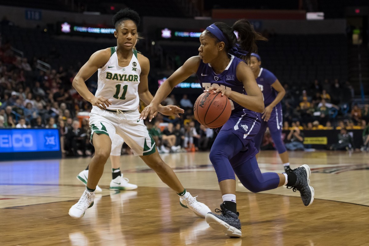 Mar 4, 2018; Oklahoma City, OK, USA; TCU Horned Frogs guard Lauren Heard (20) dribbles past Baylor Bears guard Alexis Morris (11) during the third quarter during the women's Big 12 Conference Tournament at Chesapeake Energy Arena.