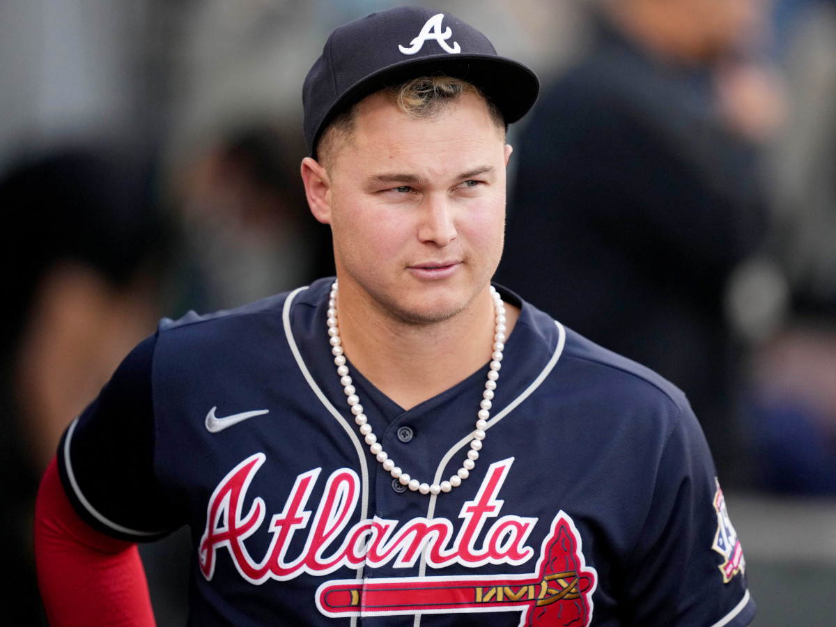 Oct 21, 2021; Los Angeles, California, USA; Atlanta Braves right fielder Joc Pederson (22) wears pearls in the dugout before game five of the 2021 NLCS against the Los Angeles Dodgers at Dodger Stadium.