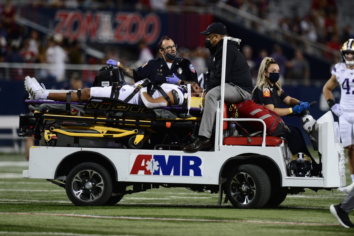 Alex Cook leaves the Arizona game with an injury.