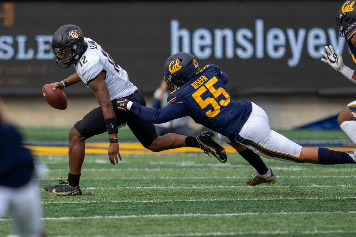 Colorado quarterback Brendon Lewis (12) scrambles out of the pocket chased by California Golden Bears Muelu Iosefa (55).