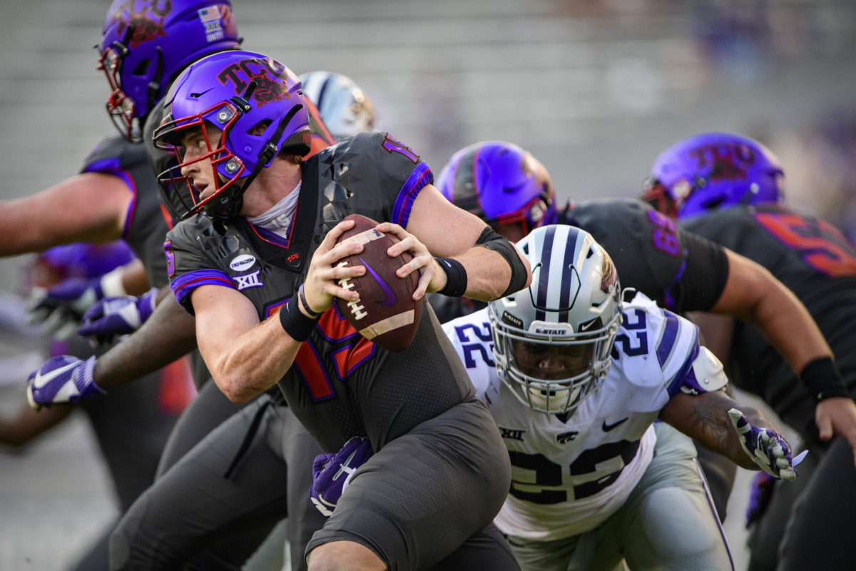Oct 10, 2020; Fort Worth, Texas, USA; TCU Horned Frogs quarterback Max Duggan (15) eludes the Kansas State Wildcats rush during the second half at Amon G. Carter Stadium.