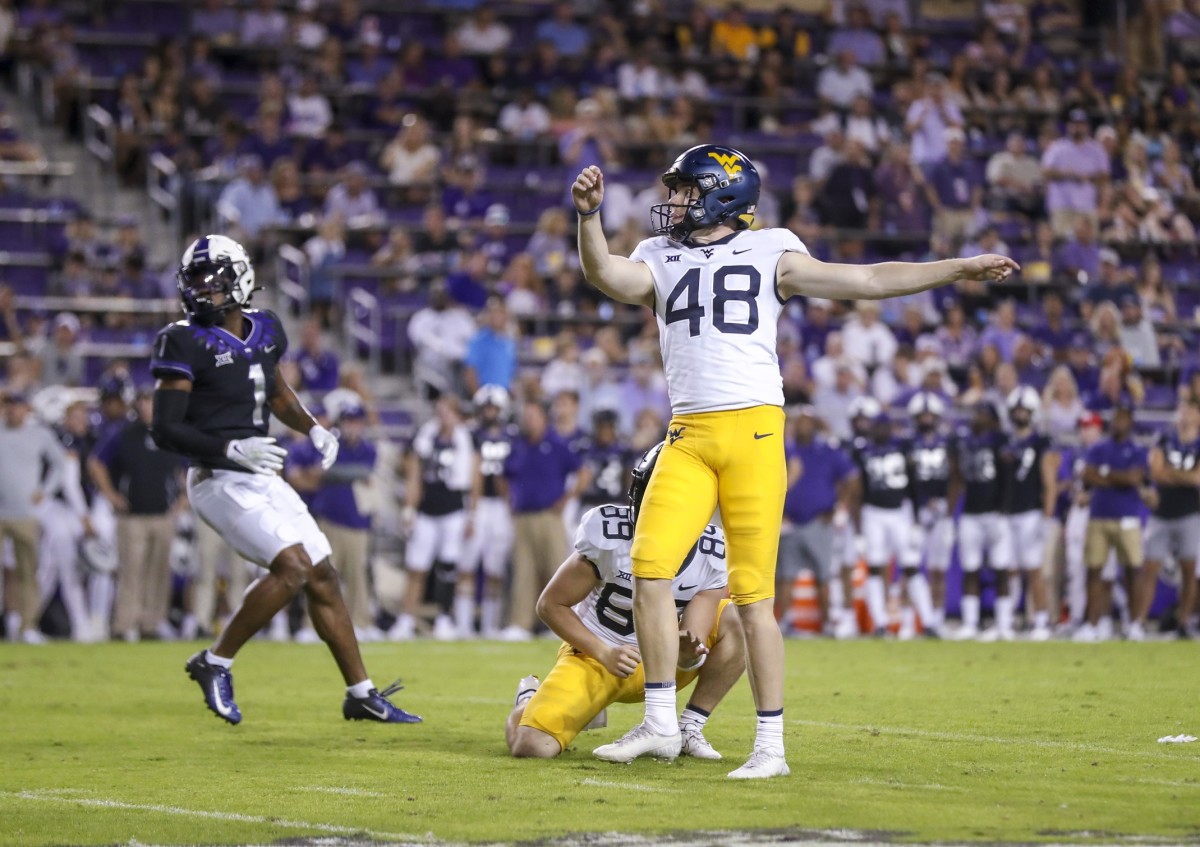 Oct 23, 2021; Fort Worth, Texas, USA; West Virginia Mountaineers place kicker Casey Legg (48) kicks a field goal during the second quarter against the TCU Horned Frogs at Amon G. Carter Stadium.