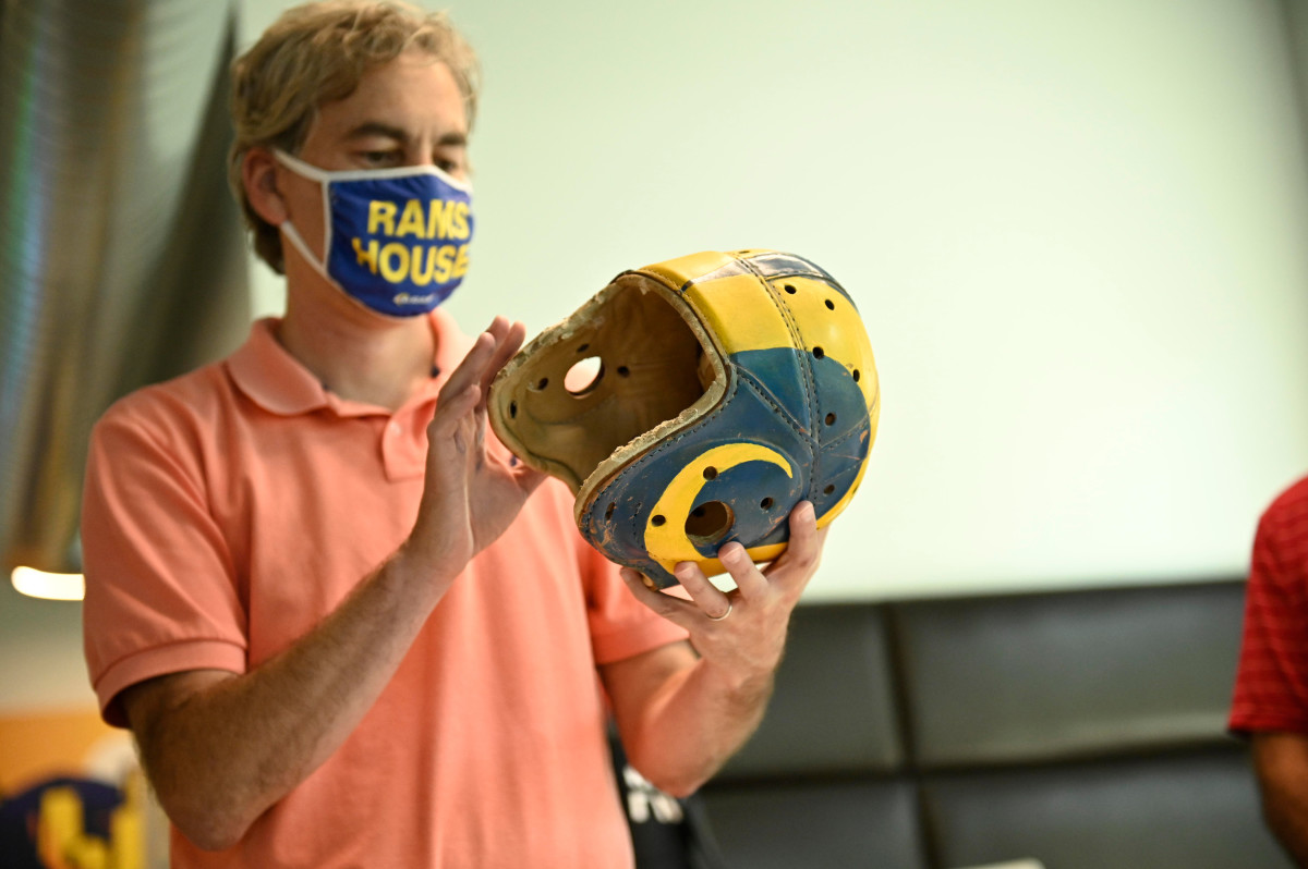 Kevin Demoff examines would could be the prototype of the first painted Rams helmet