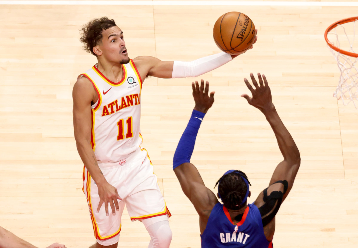 Atlanta Hawks point guard Trae Young (11) attempts a shot against Detroit Pistons forward Jerami Grant (9) during the second half at State Farm Arena.