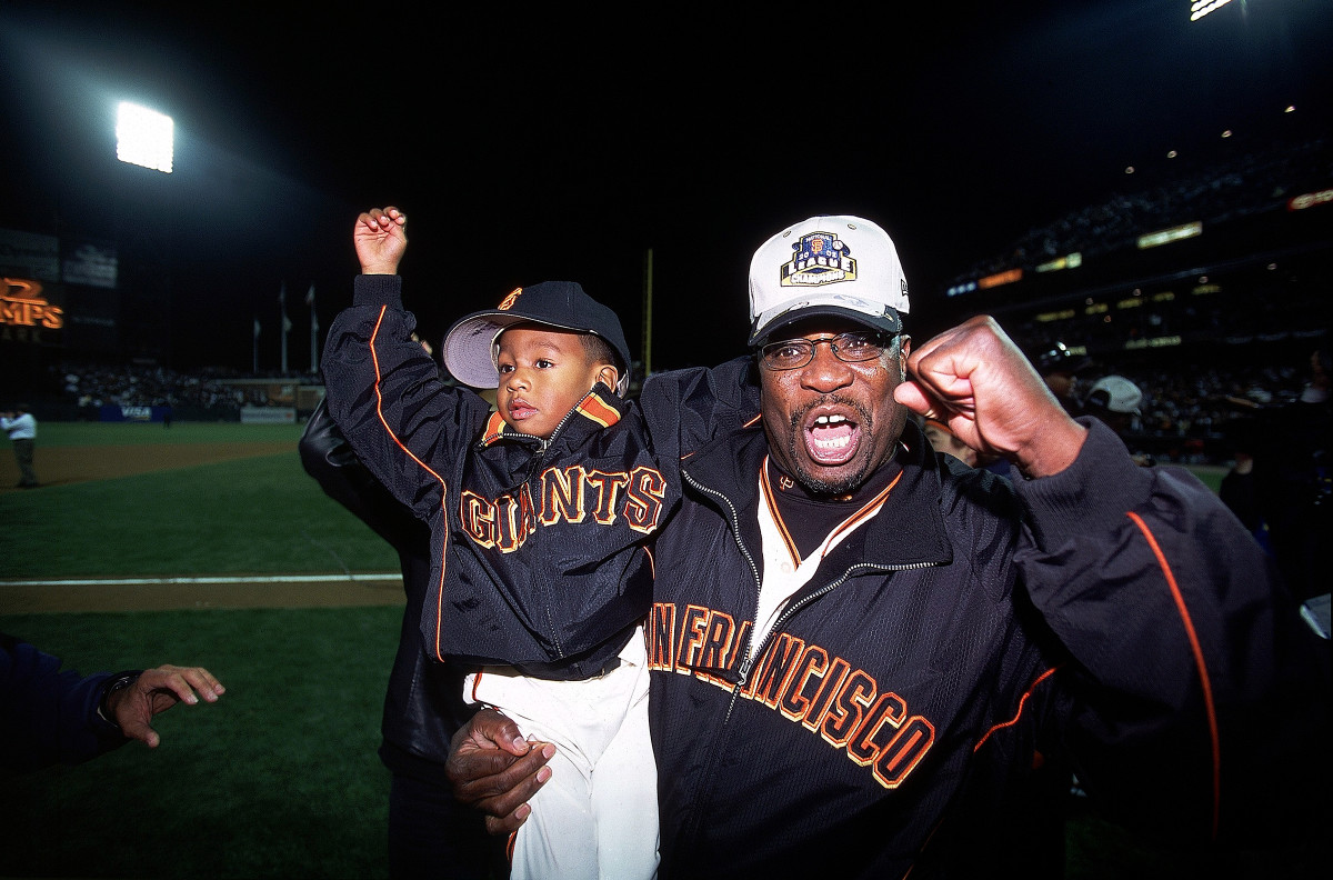 Dusty Baker and his son Darren after the Giants defeated the Cardinals to advance to the 2002 World Series.
