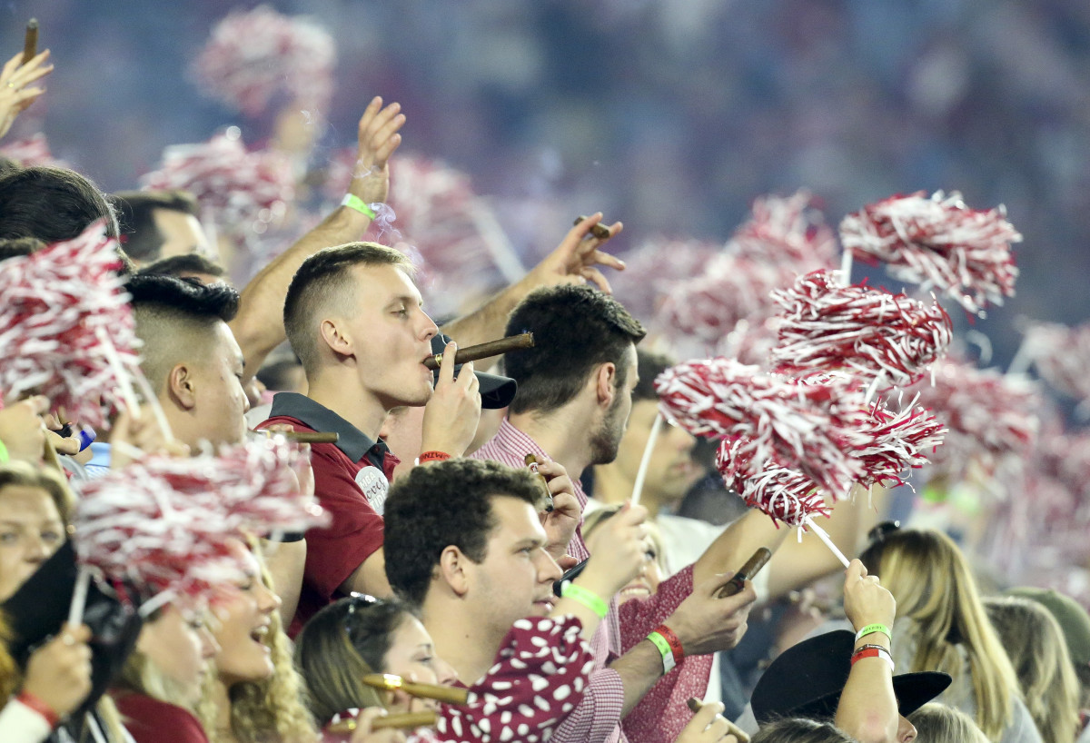 Oct 23, 2021; Tuscaloosa, Alabama, USA; Alabama Crimson Tide fans celebrate with the traditional postgame cigar after a victory over the Tennessee Volunteers at Bryant-Denny Stadium. Alabama won 52-24.