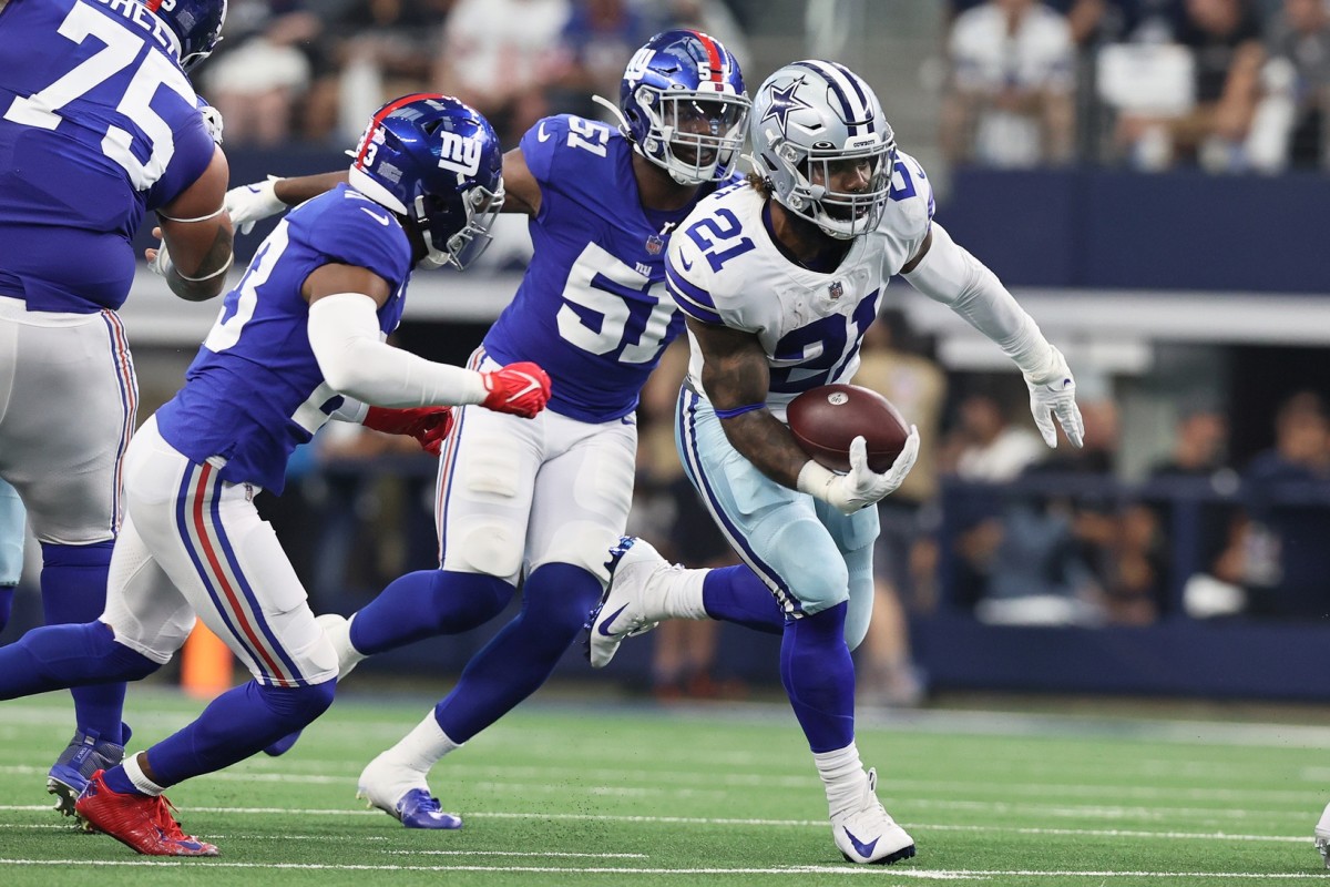 Oct 10, 2021; Arlington, Texas, USA; Dallas Cowboys running back Ezekiel Elliott (21) carries the ball as New York Giants outside linebacker Azeez Ojulari (51) chases in the second quarter at AT&T Stadium.