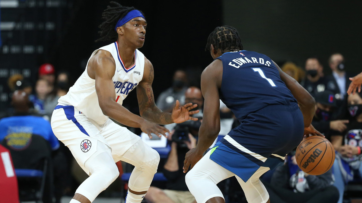 Los Angeles Clippers guard Terance Mann pressures Minnesota Timberwolves guard Anthony Edwards.