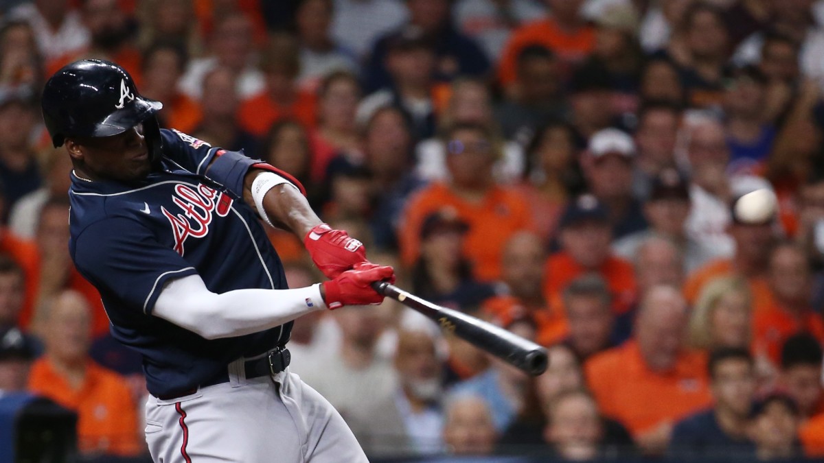 Atlanta Braves designated hitter Jorge Soler (12) hits a solo home run against the Atlanta Braves during the first inning in game one of the 2021 World Series at Minute Maid Park.