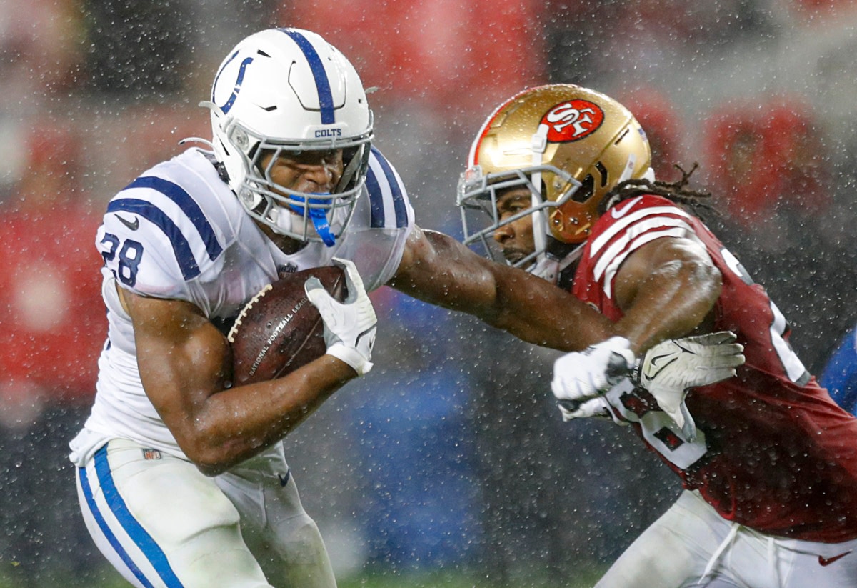 Indianapolis Colts running back Jonathan Taylor (28) fends off San Francisco 49ers cornerback Josh Norman (26) during the first half of the game Sunday, Oct. 24, 2021, at Levi's Stadium in Santa Clara, Calif.

Indianapolis Colts Visit The San Francisco 49ers For Nfl Week 7 At Levi S Stadium In Santa Clara Calif Sunday Oct 24 2021