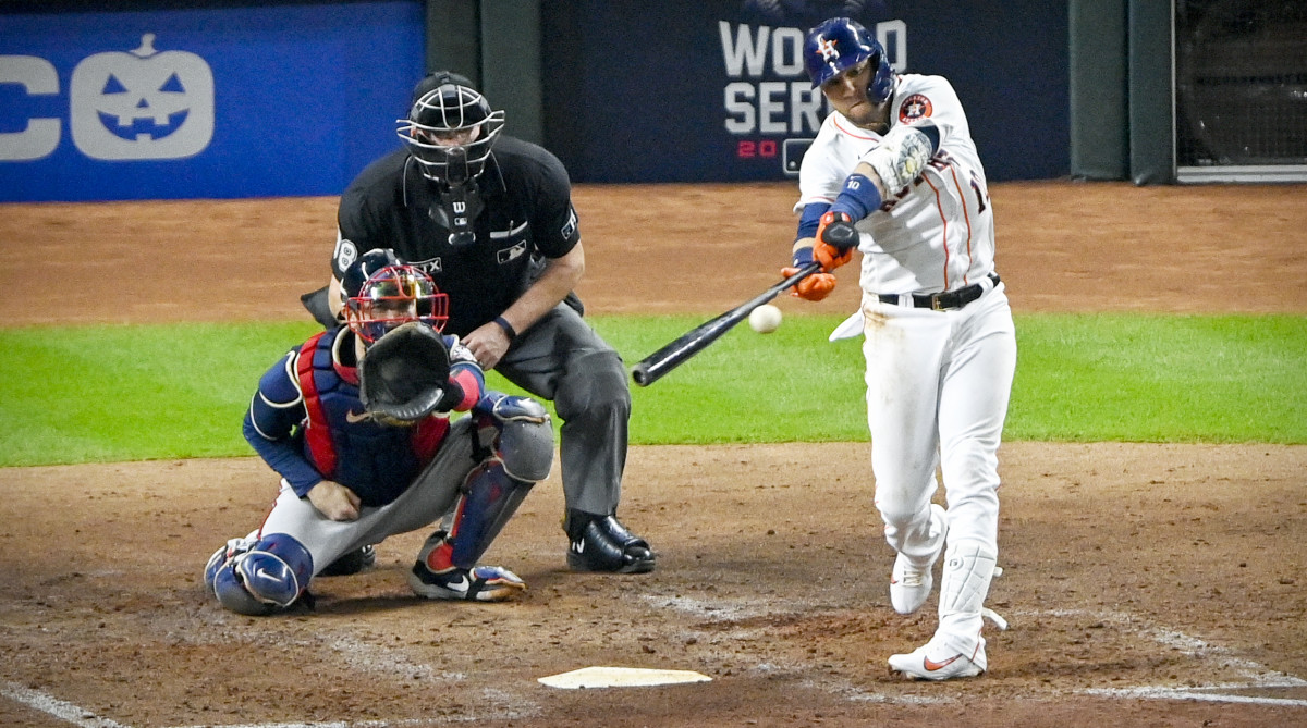 Oct 26, 2021; Houston, Texas, USA; Houston Astros first baseman Yuli Gurriel (10) hit a single against the Atlanta Braves during the fourth inning during game one of the 2021 World Series at Minute Maid Park.