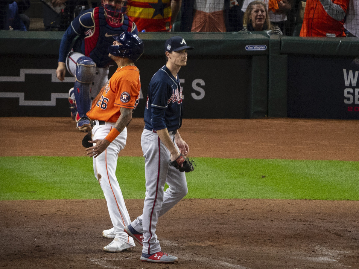 Houston Astros center fielder Jose Siri (26) celebrates as Atlanta Braves starting pitcher Max Fried (54) walks away during the second inning during game two of the 2021 World Series at Minute Maid Park.