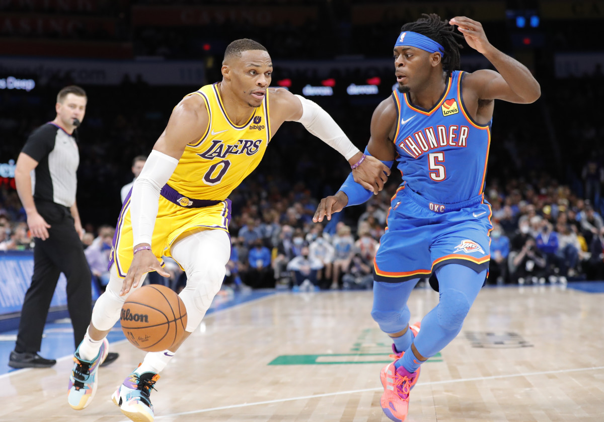 Russell Westbrook is guarded by Lu Dort