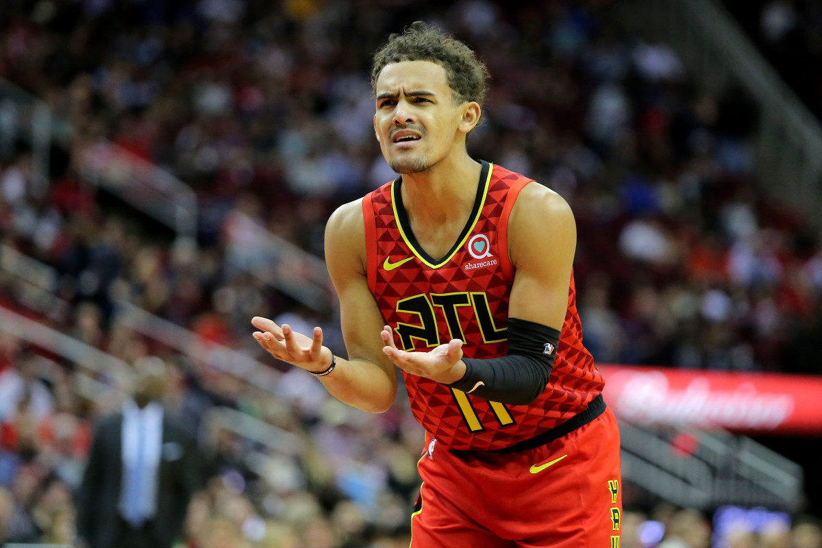 Atlanta Hawks guard Trae Young (11) reacts to a foul call during the first quarter against the Houston Rockets at Toyota Center.