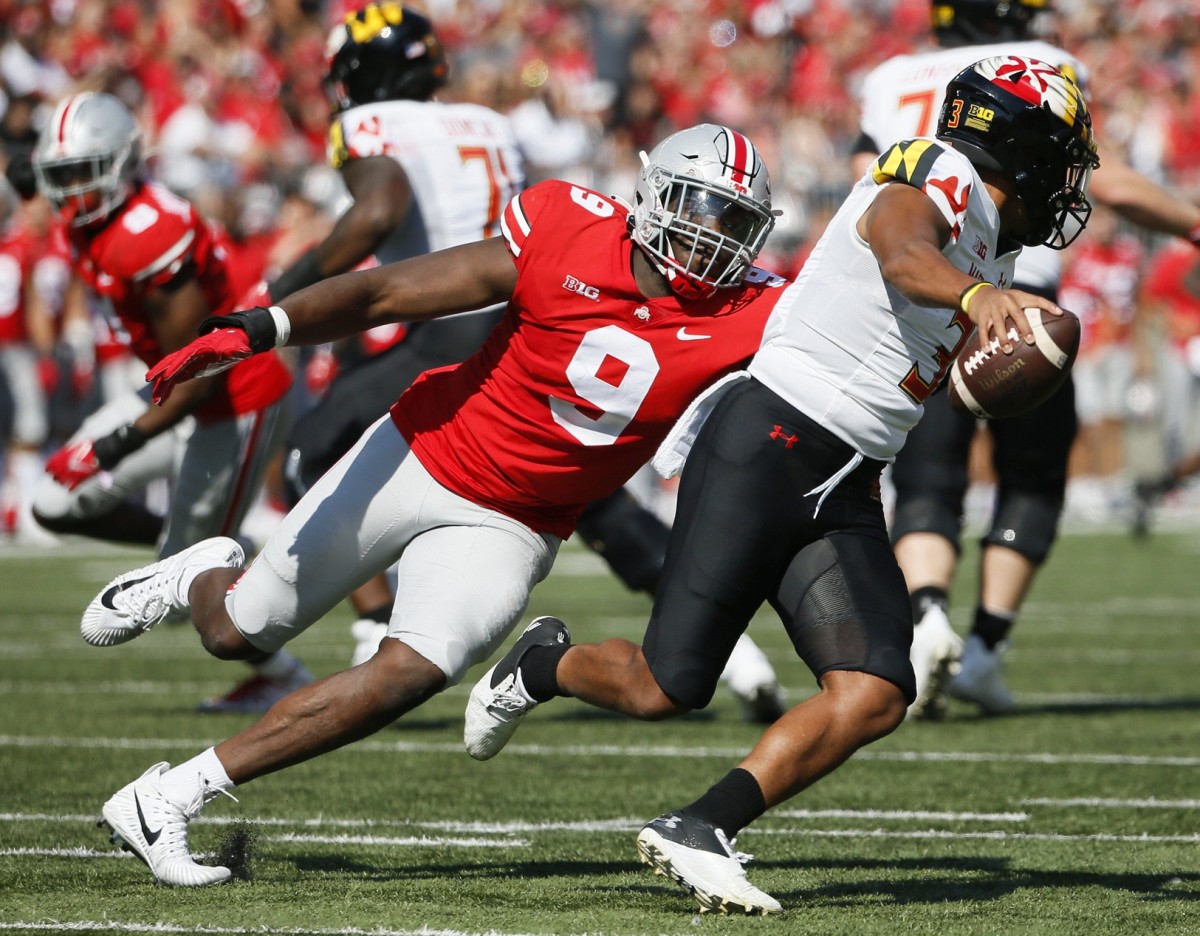 Ohio State Buckeyes defensive end Zach Harrison (9) pressures Maryland Terrapins quarterback Taulia Tagovailoa (3) during the second quarter of a NCAA Division I football game between the Ohio State Buckeyes and the Maryland Terrapins on Saturday, Oct. 9, 2021 at Ohio Stadium in Columbus, Ohio. Cfb Maryland Terrapins At Ohio State Buckeyes