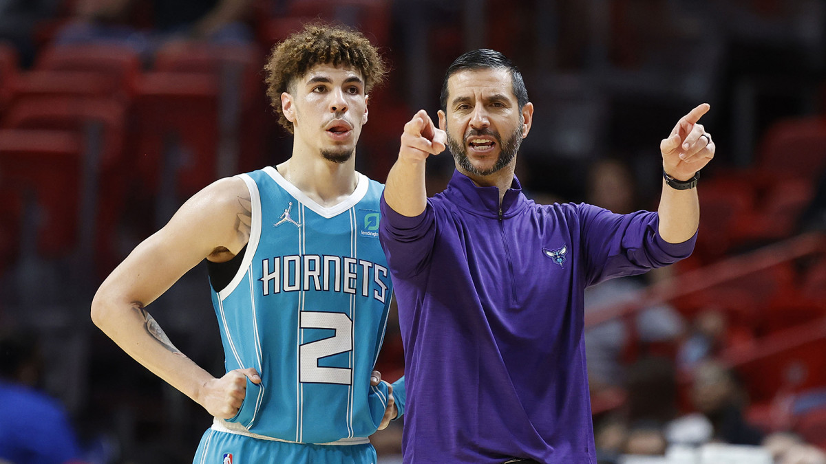 Charlotte Hornets guard LaMelo Ball and head coach James Borrego talk during a time out.