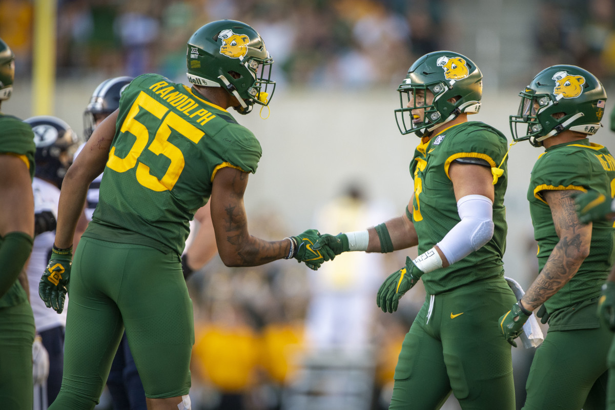 Oct 16, 2021; Waco, Texas, USA; Baylor Bears linebacker Dillon Doyle (5) and linebacker Garmon Randolph (55) celebrates Doyle making a sack against the Brigham Young Cougars during the second half at McLane Stadium.