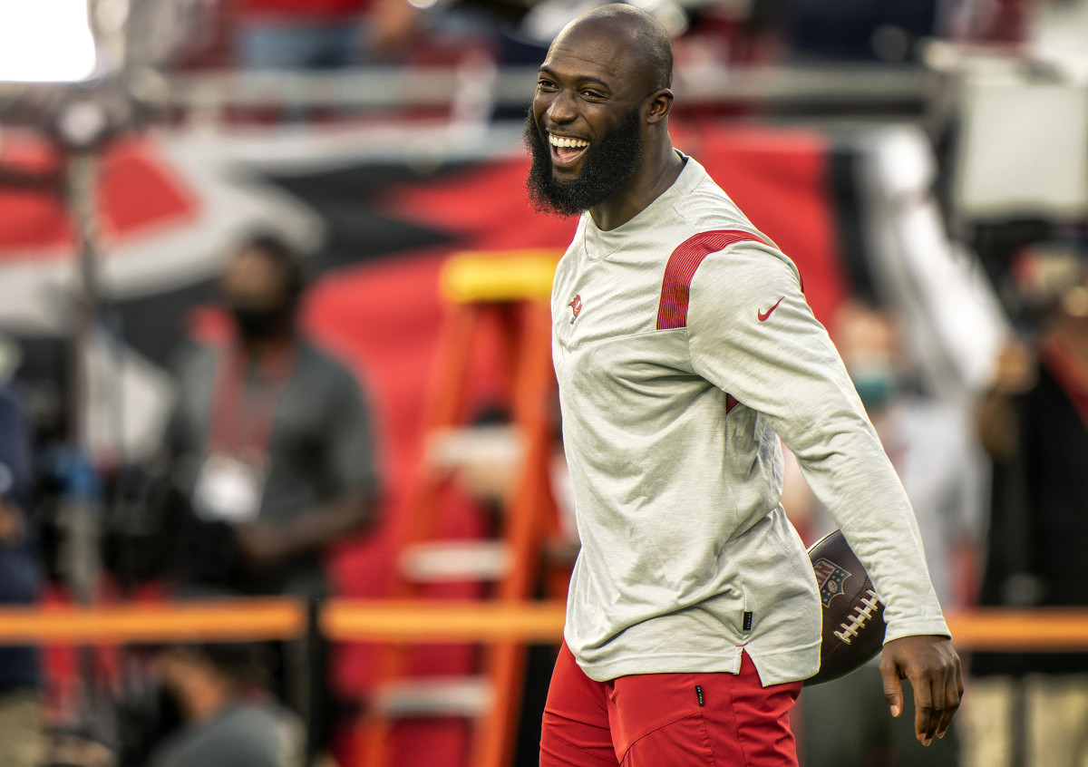 Leonard Fournette smiles on the field during pregame warmups before a 2020 game.
