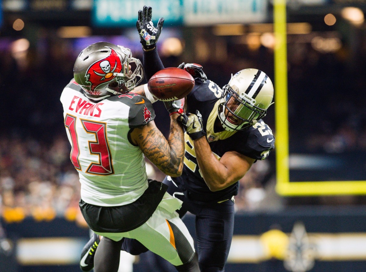 New Orleans Saints cornerback Marshon Lattimore breaks up a pass to Tampa Bay Buccaneers receiver Mike Evans. Mandatory Credit: Scott Clause/The Daily Advertiser via USA TODAY NETWORK