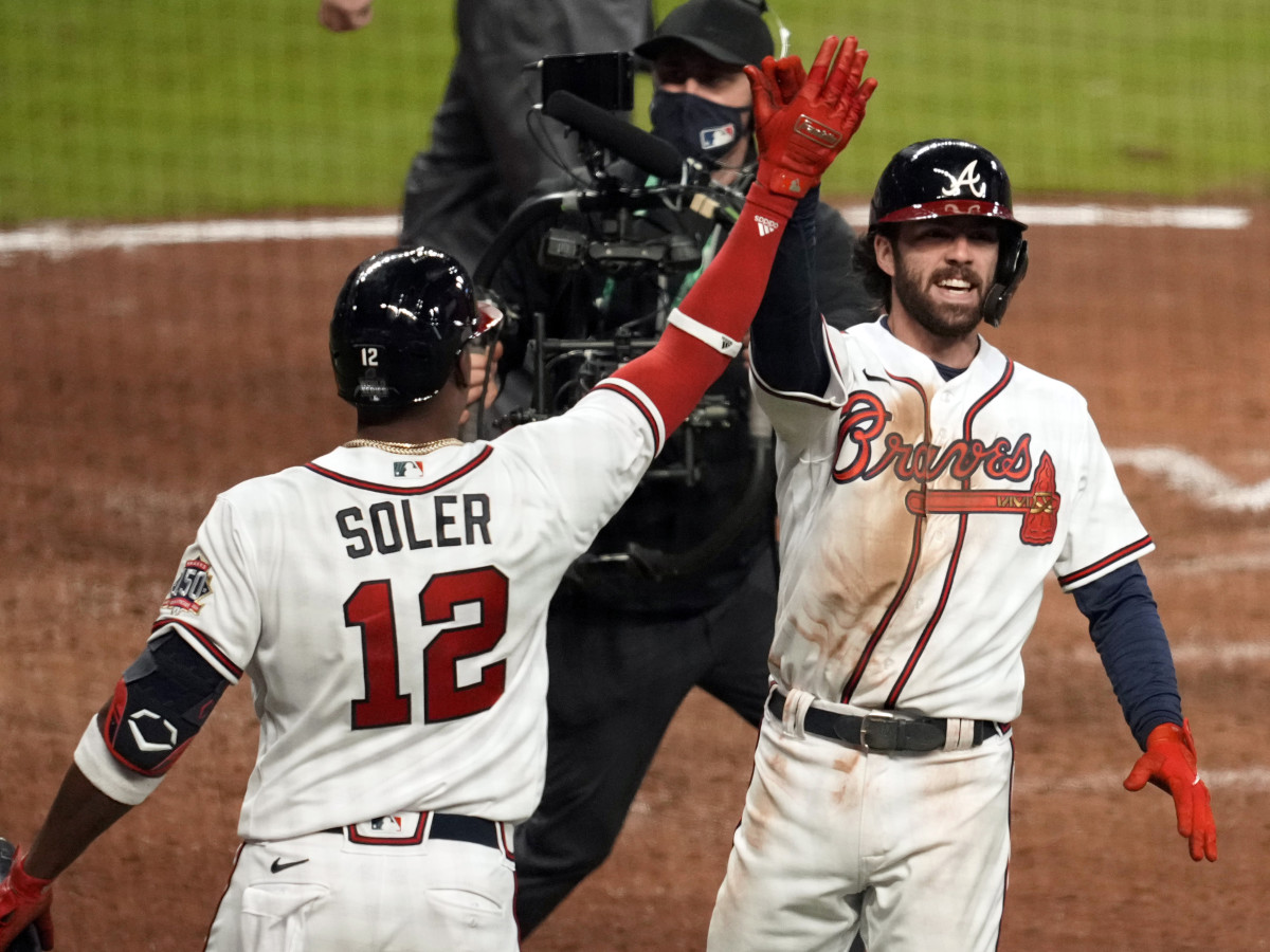 Oct 30, 2021; Atlanta, Georgia, USA; Atlanta Braves shortstop Dansby Swanson (7) celebrates a home run against the Houston Astros with designated hitter Jorge Soler (12) during the seventh inningof game four of the 2021 World Series at Truist Park.