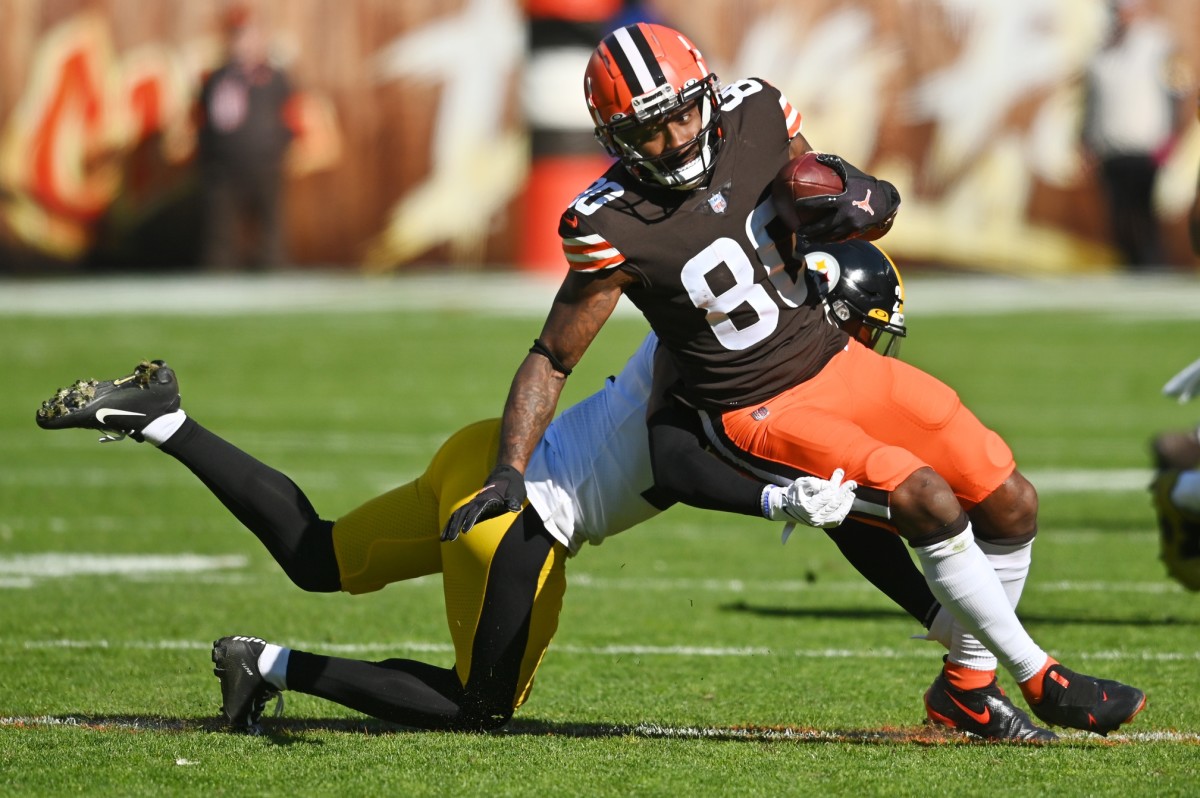 Oct 31, 2021; Cleveland, Ohio, USA; Cleveland Browns wide receiver Jarvis Landry (80) is tackled by Pittsburgh Steelers cornerback Tre Norwood (21) during the first half at FirstEnergy Stadium. Mandatory Credit: Ken Blaze-USA TODAY Sports