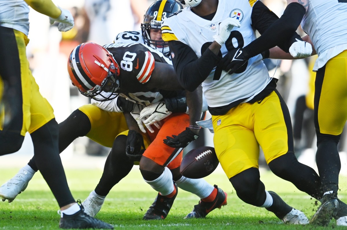 Oct 31, 2021; Cleveland, Ohio, USA; Cleveland Browns wide receiver Jarvis Landry (80) fumbles the ball as he is hit by Pittsburgh Steelers inside linebacker Joe Schobert (93) during the second half at FirstEnergy Stadium. Mandatory Credit: Ken Blaze-USA TODAY Sports