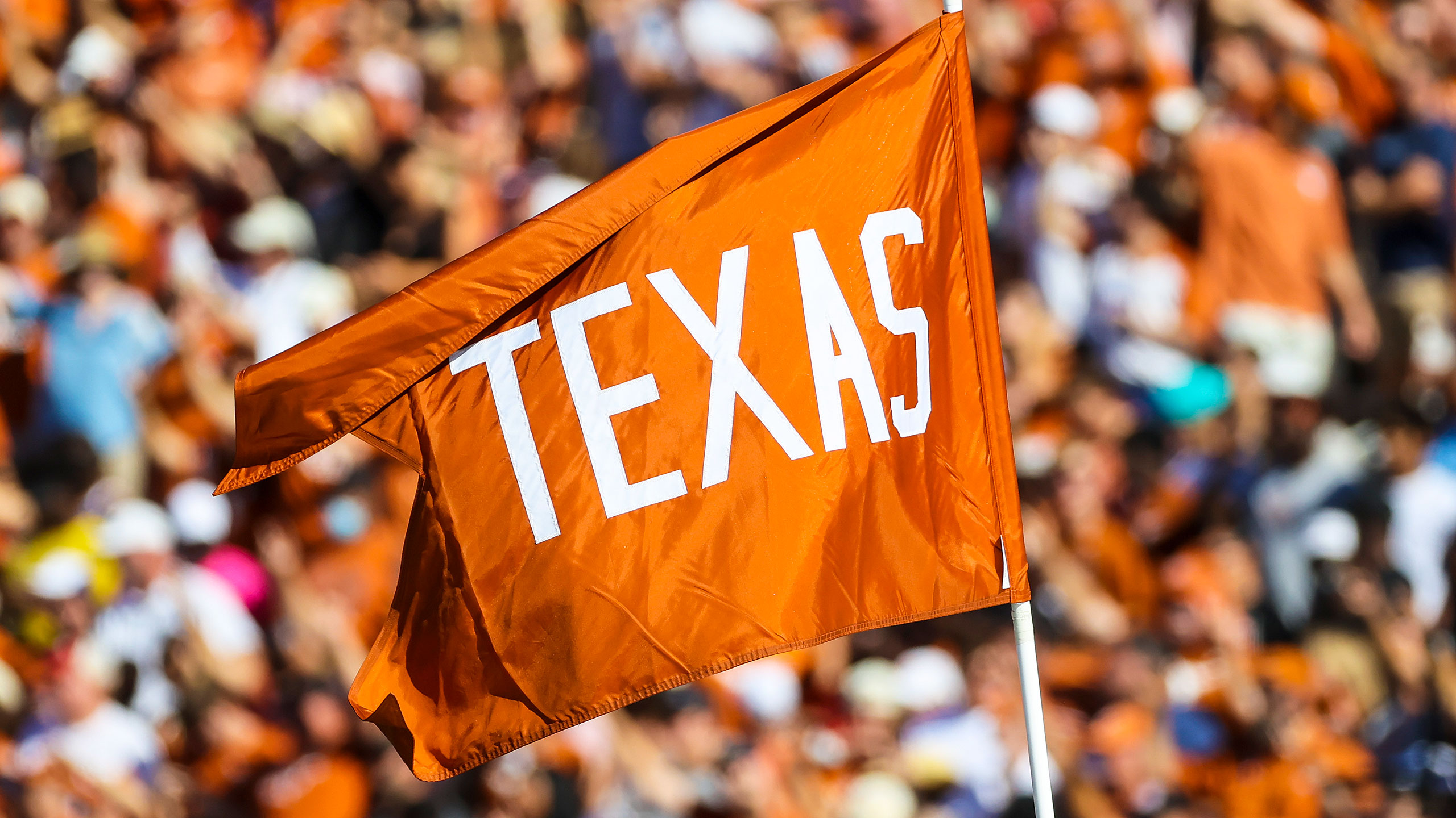 A flag at the Cotton Bowl reads "Texas"