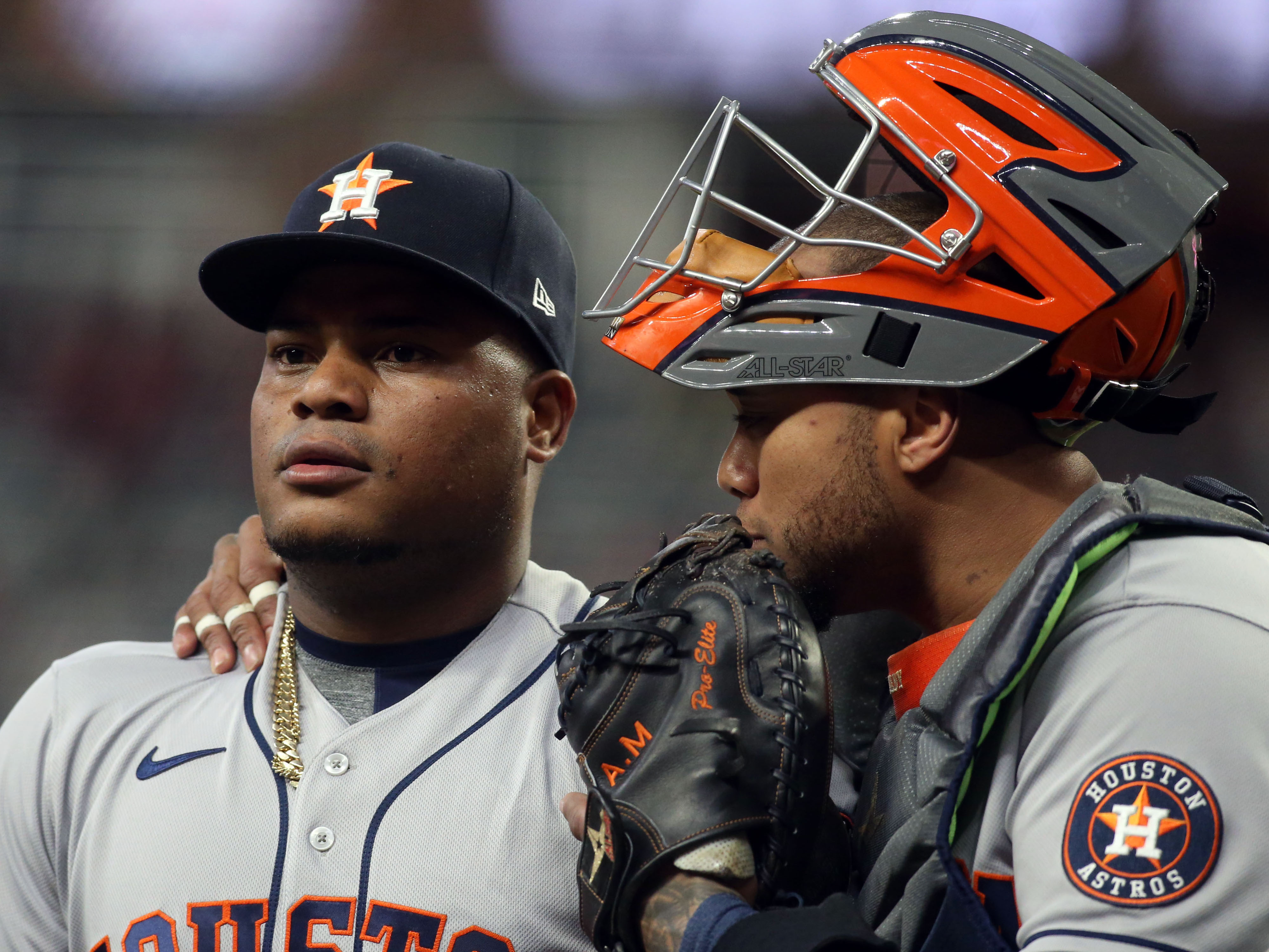 Houston Astros catcher Martin Maldonado (15) talks with starting pitcher Framber Valdez (59) after he gave up a grand slam during to the Atlanta Braves in the first inning of Game 5.