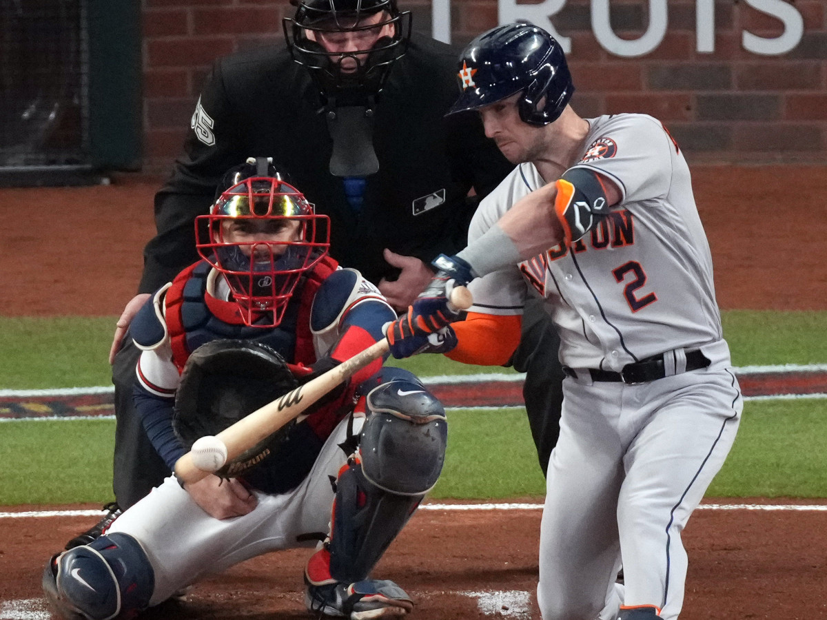 Houston Astros third baseman Alex Bregman (2) hits an RBI double against the Atlanta Braves during the second inning of game five of the 2021 World Series at Truist Park.
