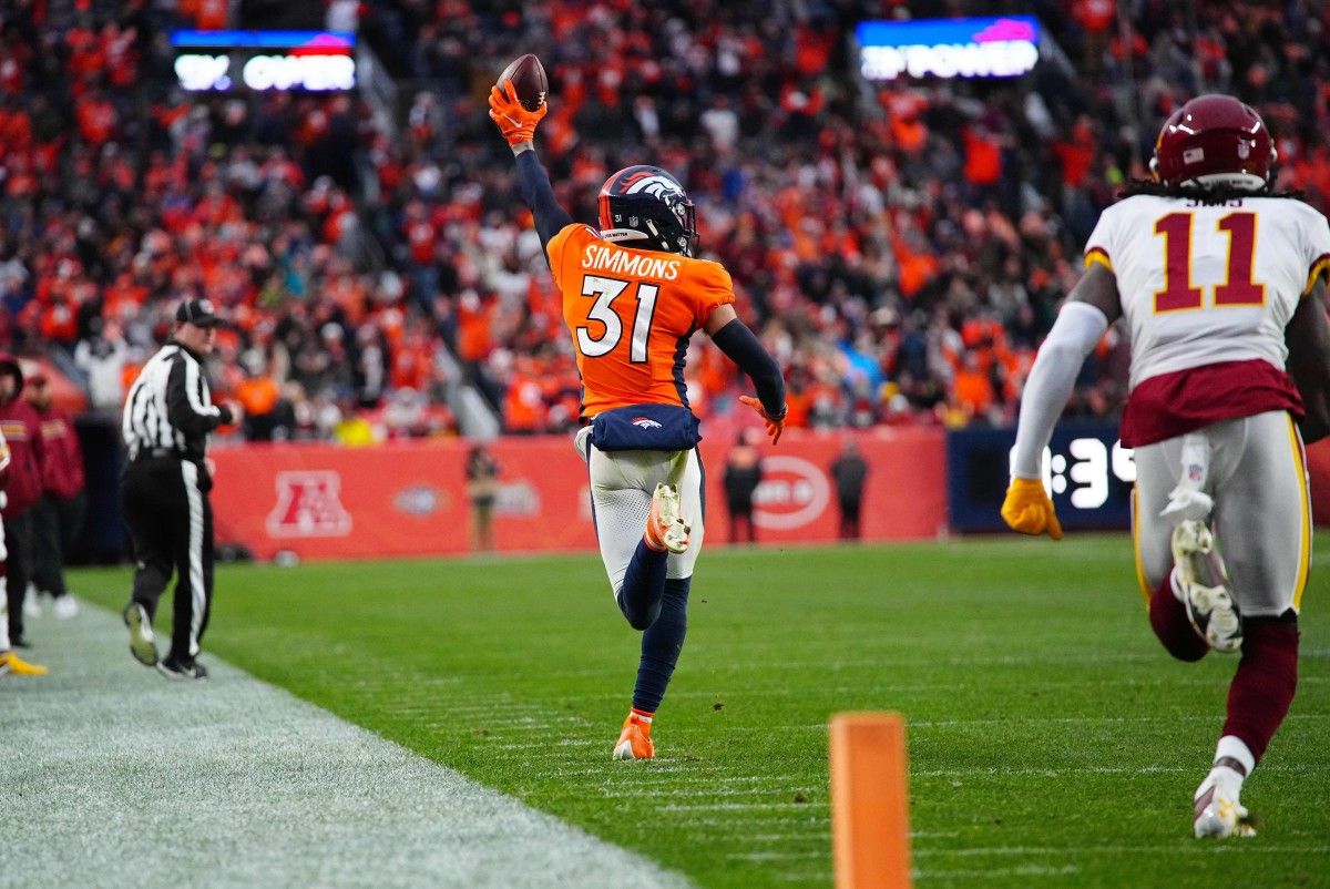 Denver Broncos free safety Justin Simmons (31) returns a interception in the fourth quarter against the Washington Football Team at Empower Field at Mile High.
