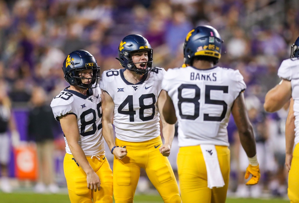 Oct 23, 2021; Fort Worth, Texas, USA; West Virginia Mountaineers place kicker Casey Legg (48) celebrates with teammates following a made field goal during the third quarter against the TCU Horned Frogs at Amon G. Carter Stadium.