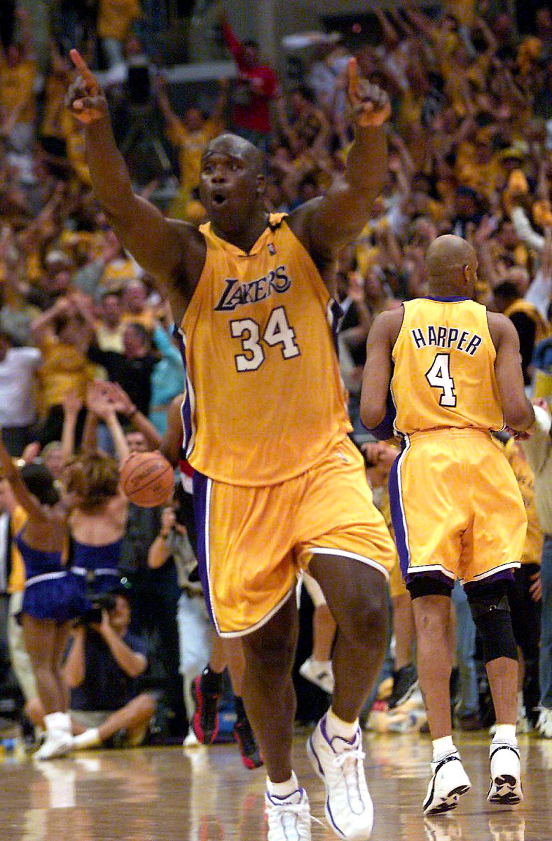 Shaq celebrates after dunk