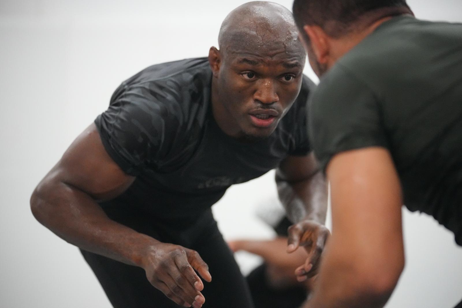 Usman prepares for a takedown during a sparring session.