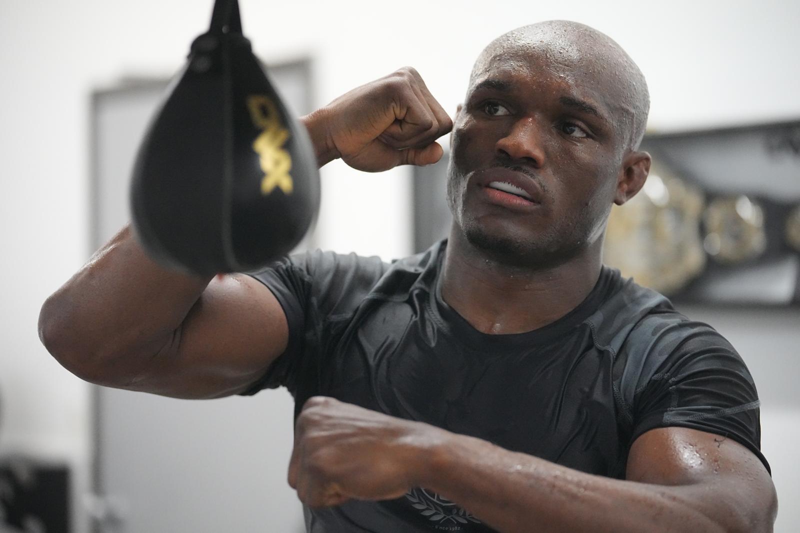 Usman hits the speed bag in training camp.