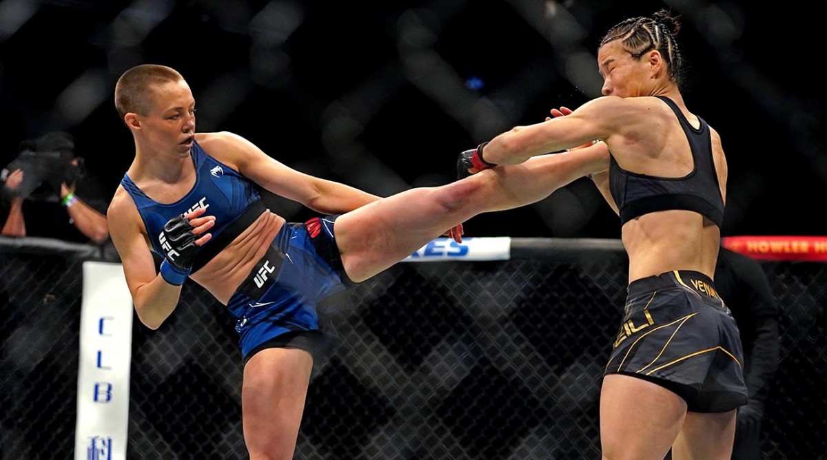 Rose Namajunas (left) kicks Zhang Weili (right) for a TKO during UFC 261 at VyStar Veterans Memorial Arena in April 2021.