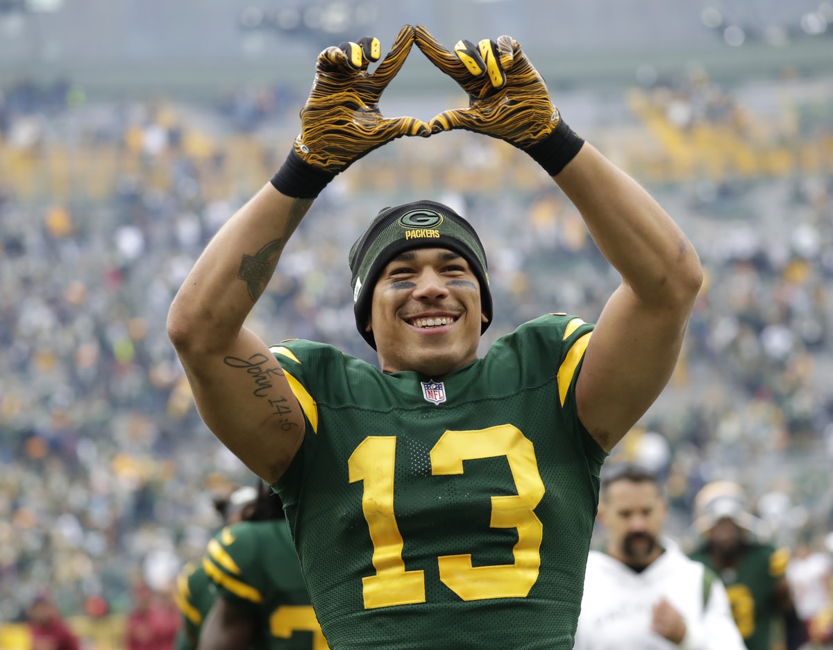Oct 24, 2021; Green Bay, WI, USA; Green Bay Packers wide receiver Allen Lazard (13) is all smiles as he celebrates a victory against the Washington Football Team during their football game Sunday, October 24, 2021, at Lambeau Field in Green Bay, Wis. Mandatory Credit: Dan Powers-USA TODAY Sports
