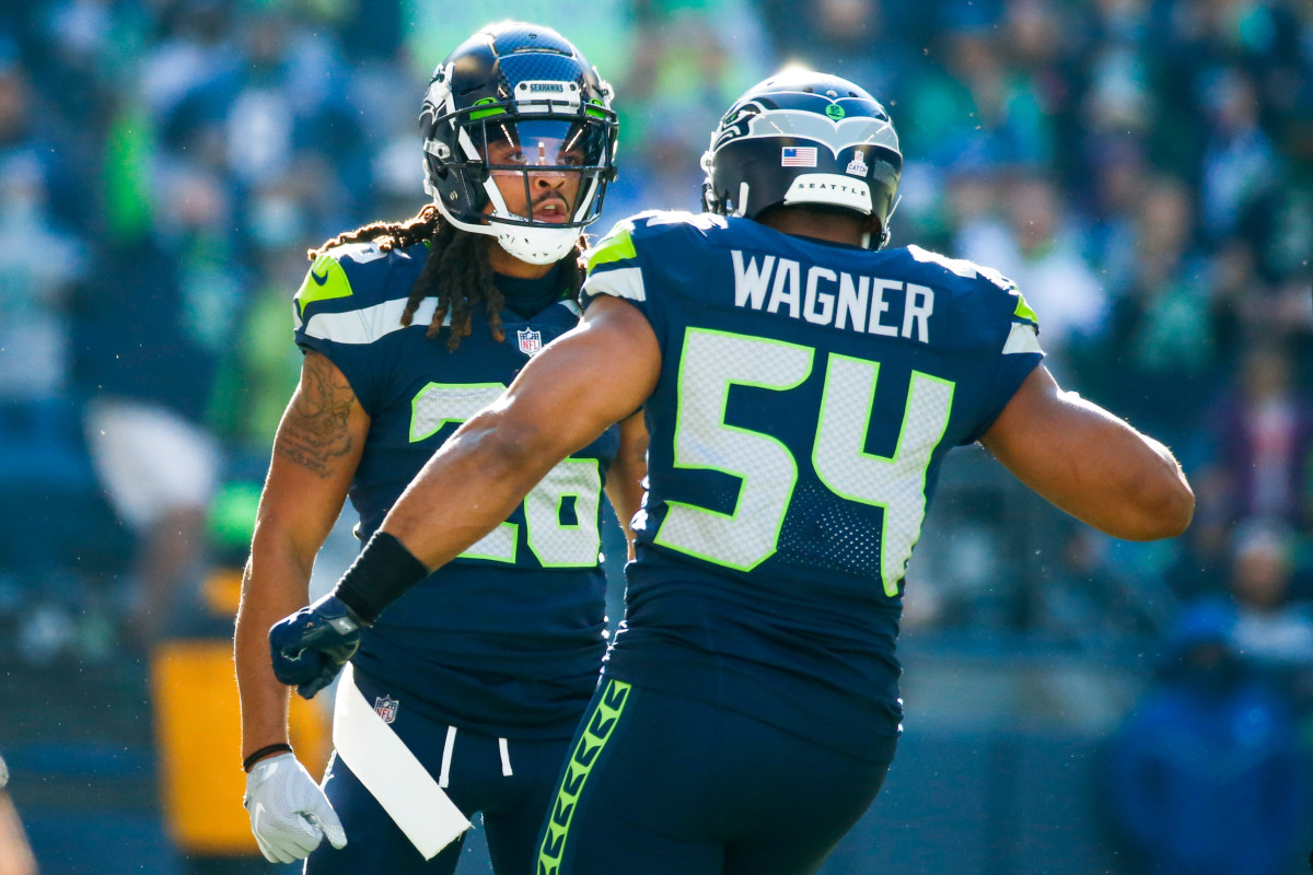 Seattle Seahawks defensive back Ryan Neal (26) celebrates following a sack against the Jacksonville Jaguars during the first quarter at Lumen Field.