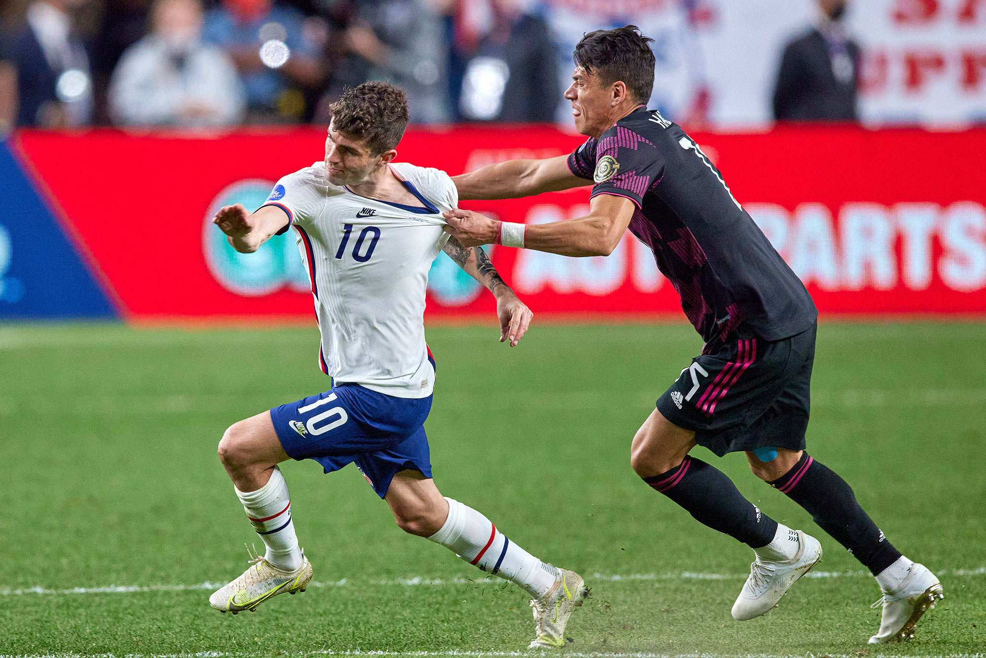 USMNT's Christian Pulisic is fouled by Mexico's Hector Moreno