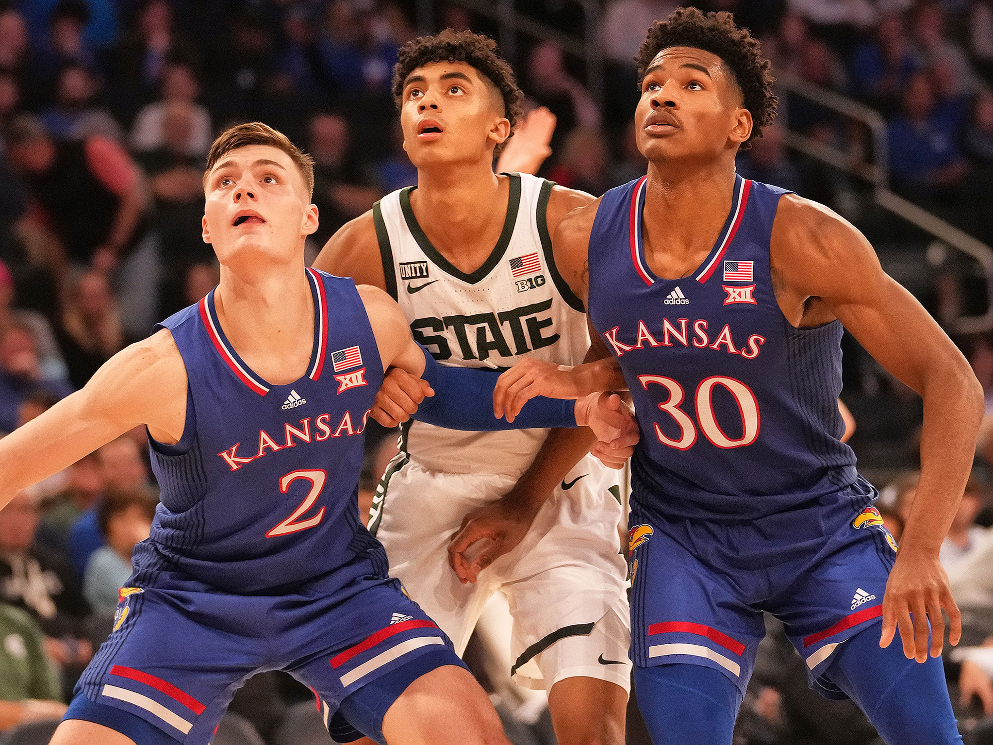 Kansas and Michigan State players battle for a rebound