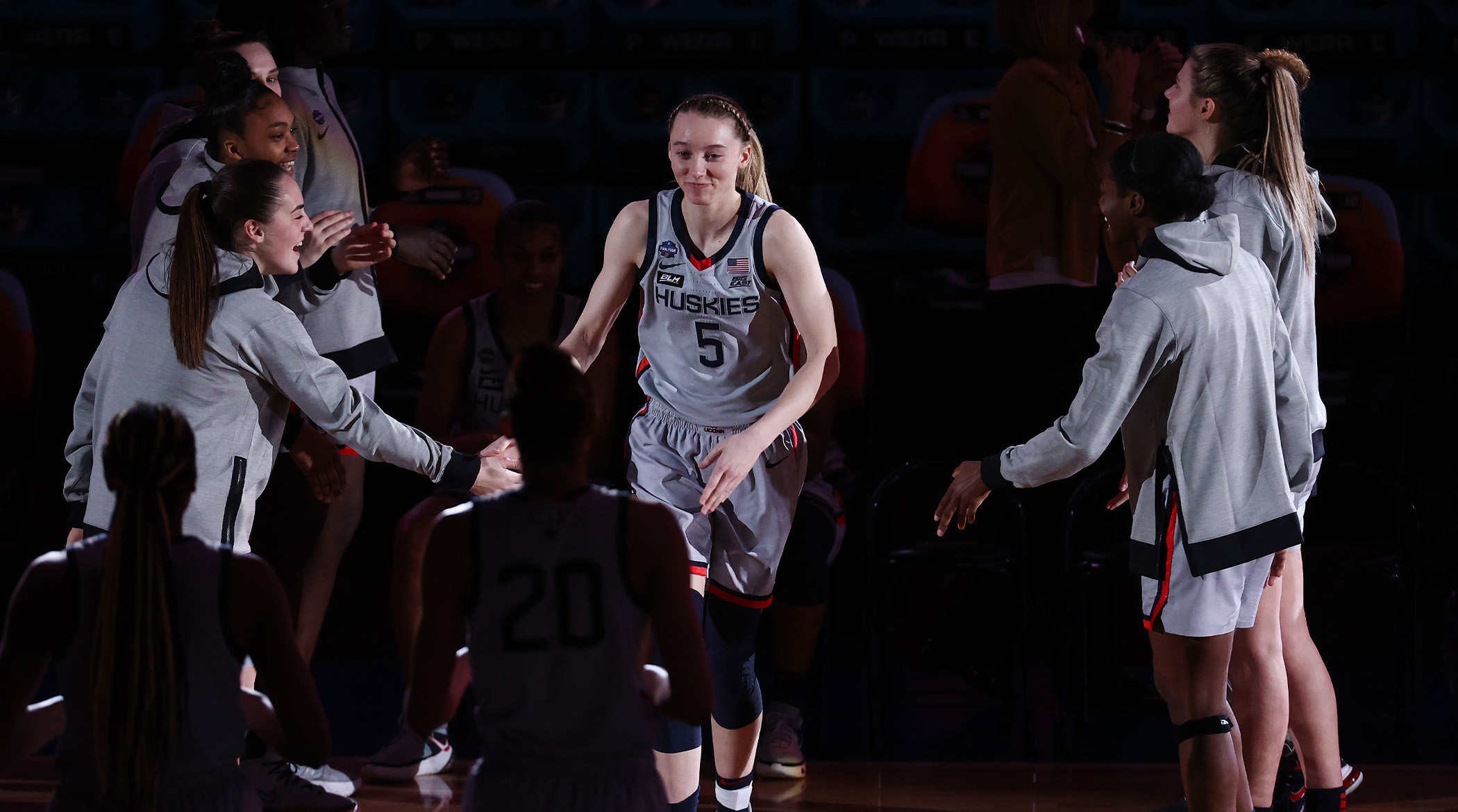 Apr 2, 2021; San Antonio, Texas, USA; UConn Huskies guard Paige Bueckers (5) celebrates with teammates during player introductions prior to their game against the Arizona Wildcats in the national semifinals of the women's Final Four of the 2021 NCAA Tournament at Alamodome.