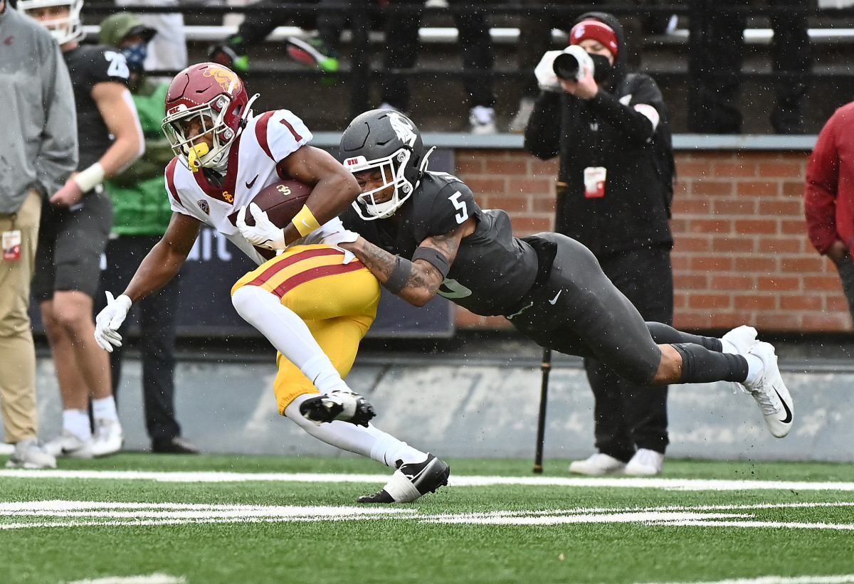 USC Trojans wide receiver Gary Bryant Jr. (1) is tackled after the first down by Washington State Cougars defensive back Derrick Langford (5).