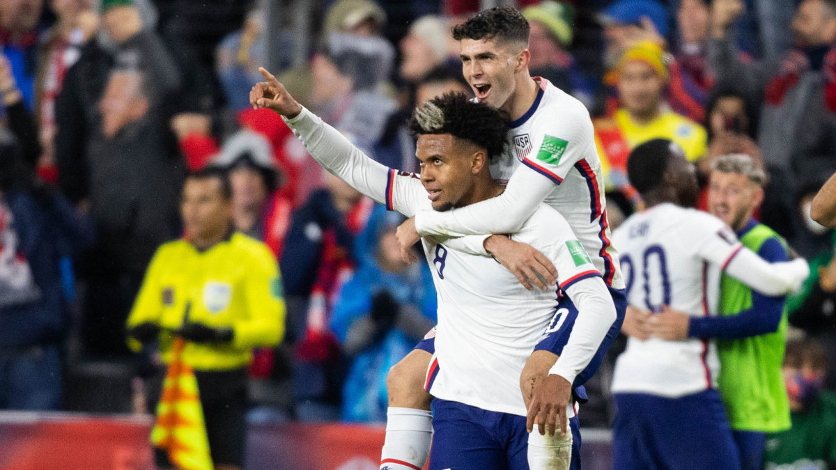 Christian Pulisic and Weston McKennie celebrate a U.S. World Cup qualifying win over Mexico.