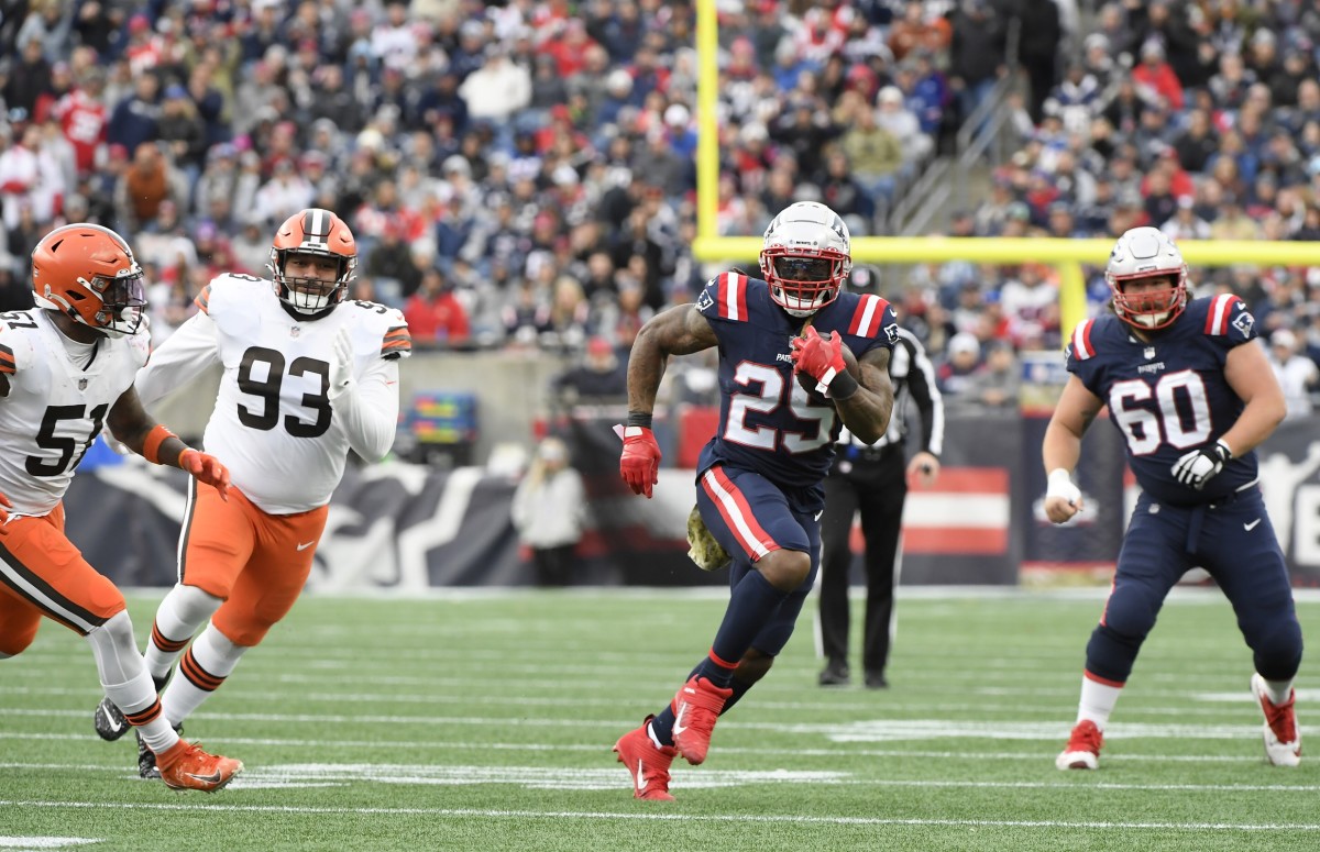 Nov 14, 2021; New England Patriots running back Brandon Bolden (25) runs with the ball while Cleveland Browns outside linebacker Mack Wilson (51) and defensive tackle Tommy Togiai (93) gives chase during the second half at Gillette Stadium. Foxborough, Massachusetts, USA; Mandatory Credit: Bob DeChiara-USA TODAY Sports
