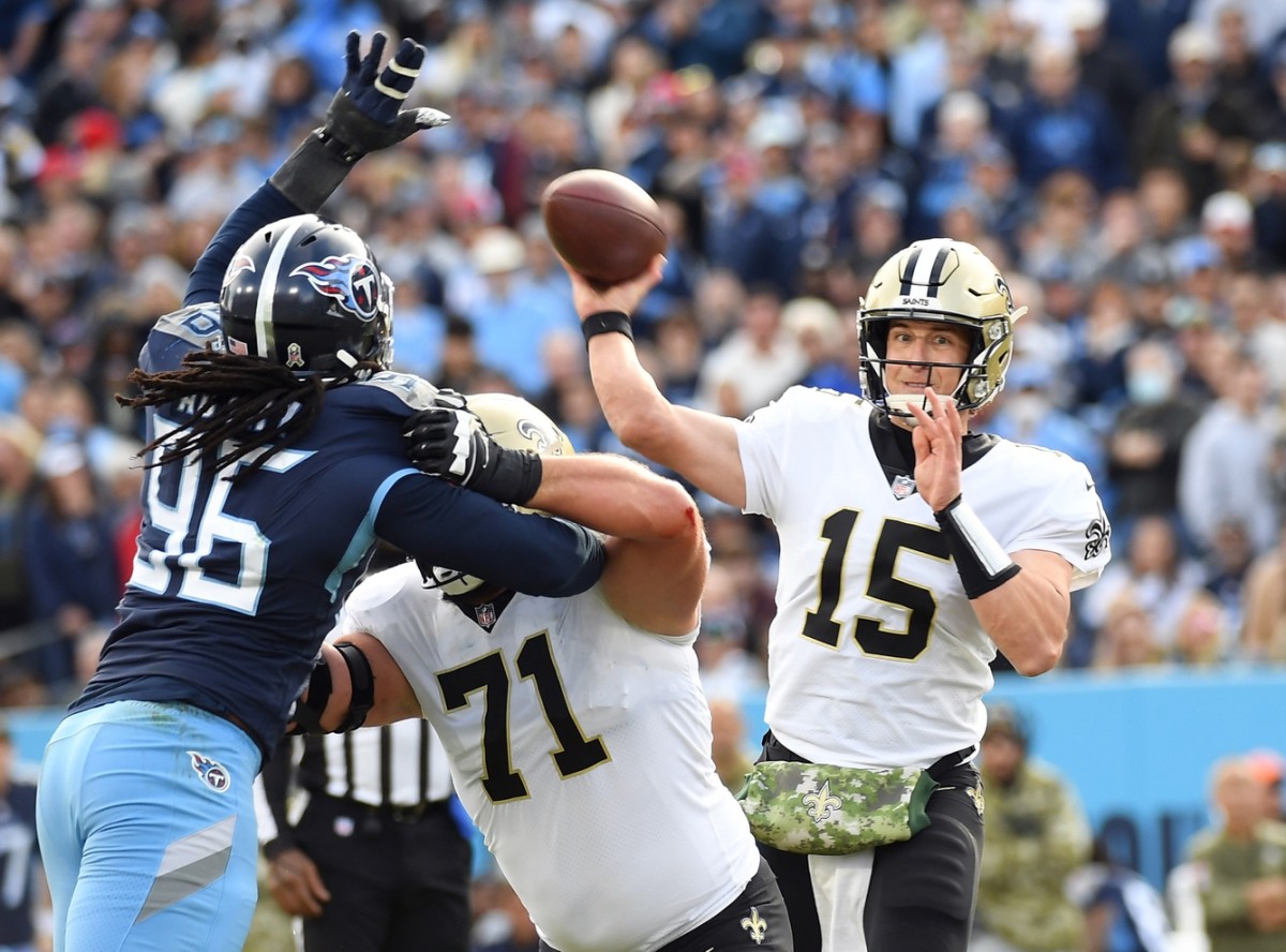 New Orleans Saints quarterback Trevor Siemian (15) attempts a pass against the Titans. Mandatory Credit: Christopher Hanewinckel-USA TODAY