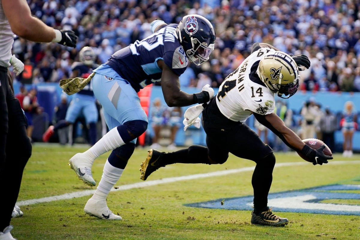 New Orleans Saints running back Mark Ingram (14) scores a touchdown past Tennessee Titans linebacker Ola Adeniyi (92). Andrew Nelles / Tennessean.com / USA TODAY NETWORK
