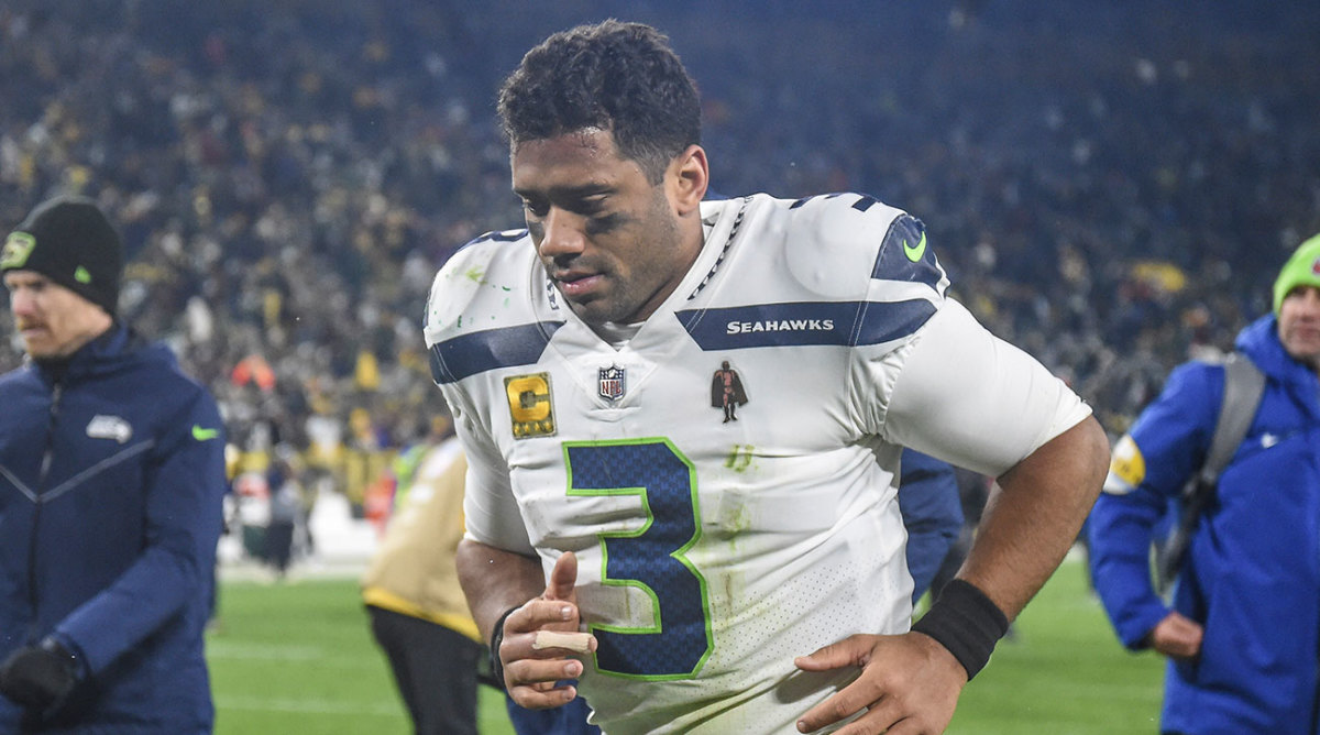 Seahawks quarterback Russell Wilson jogs off the field.