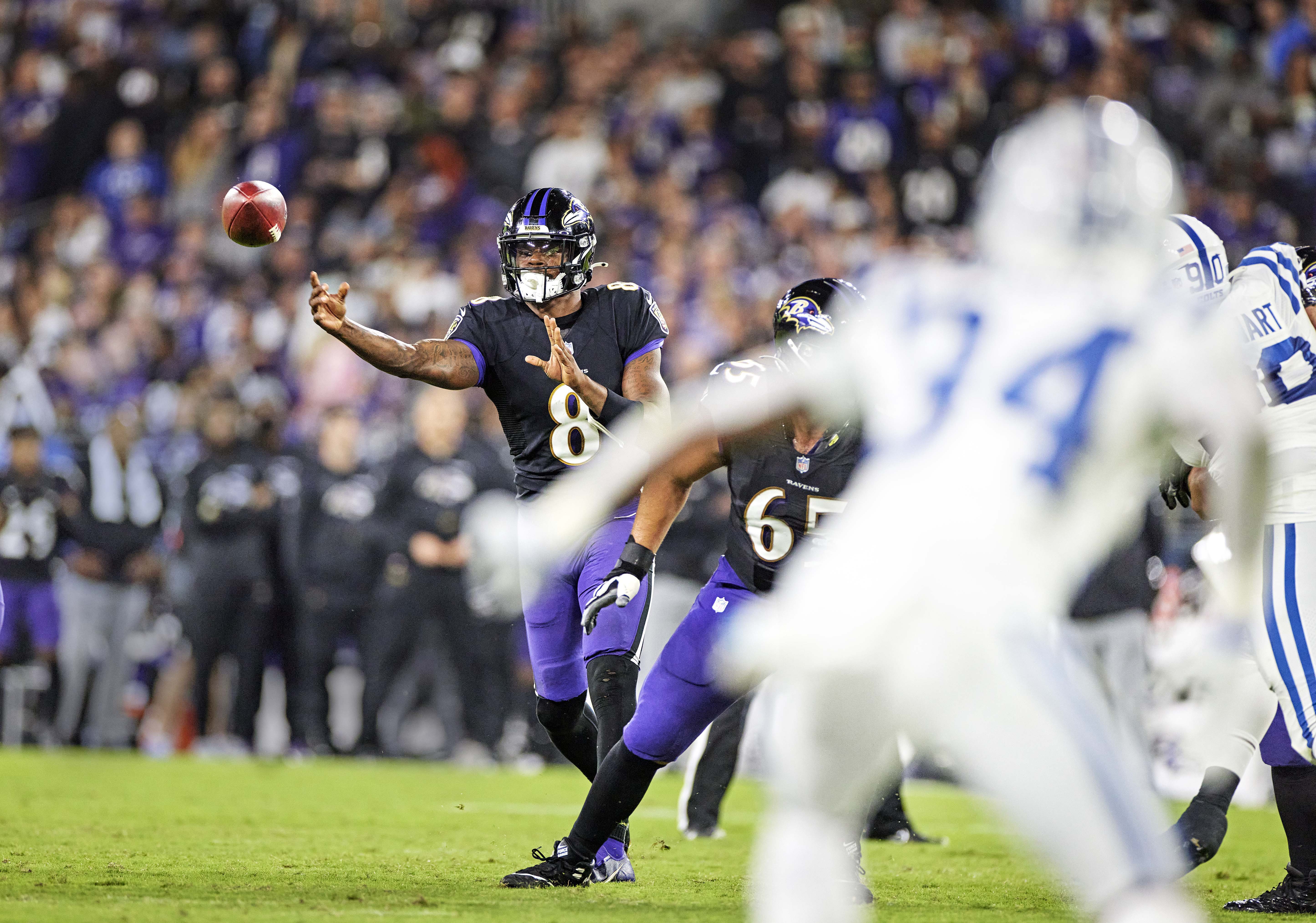 Lamar Jackson throws a sidearm pass during a game against the Colts