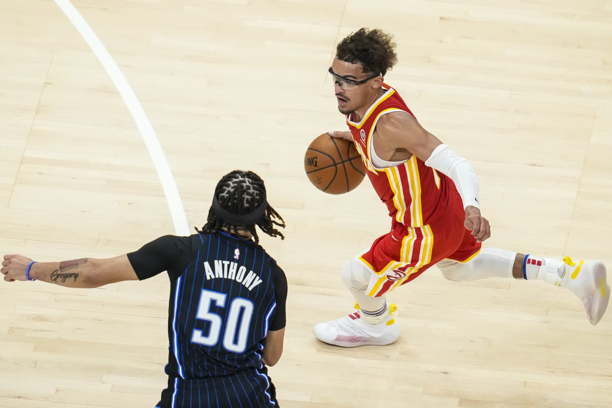 Atlanta Hawks guard Trae Young (11) dribbles past Orlando Magic guard Cole Anthony (50) during the second half at State Farm Arena.