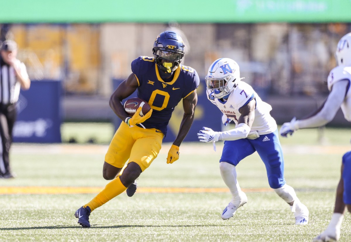 Oct 17, 2020; Morgantown, West Virginia, USA; West Virginia Mountaineers wide receiver Bryce Ford-Wheaton (0) runs after a catch during the third quarter against the Kansas Jayhawks at Mountaineer Field at Milan Puskar Stadium.